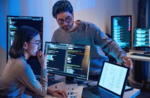 Man and Woman Working on Software Development