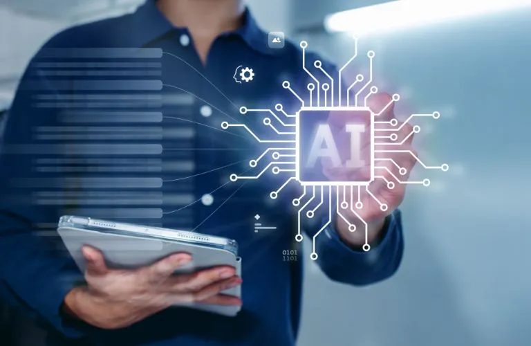 Person holding tablet with holographic AI chip and digital interface elements.